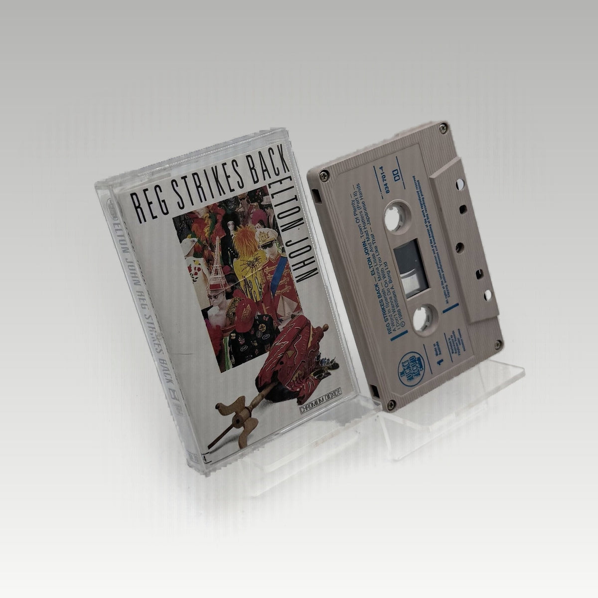 Elton John - Reg Strikes Back • CIB - Image 1