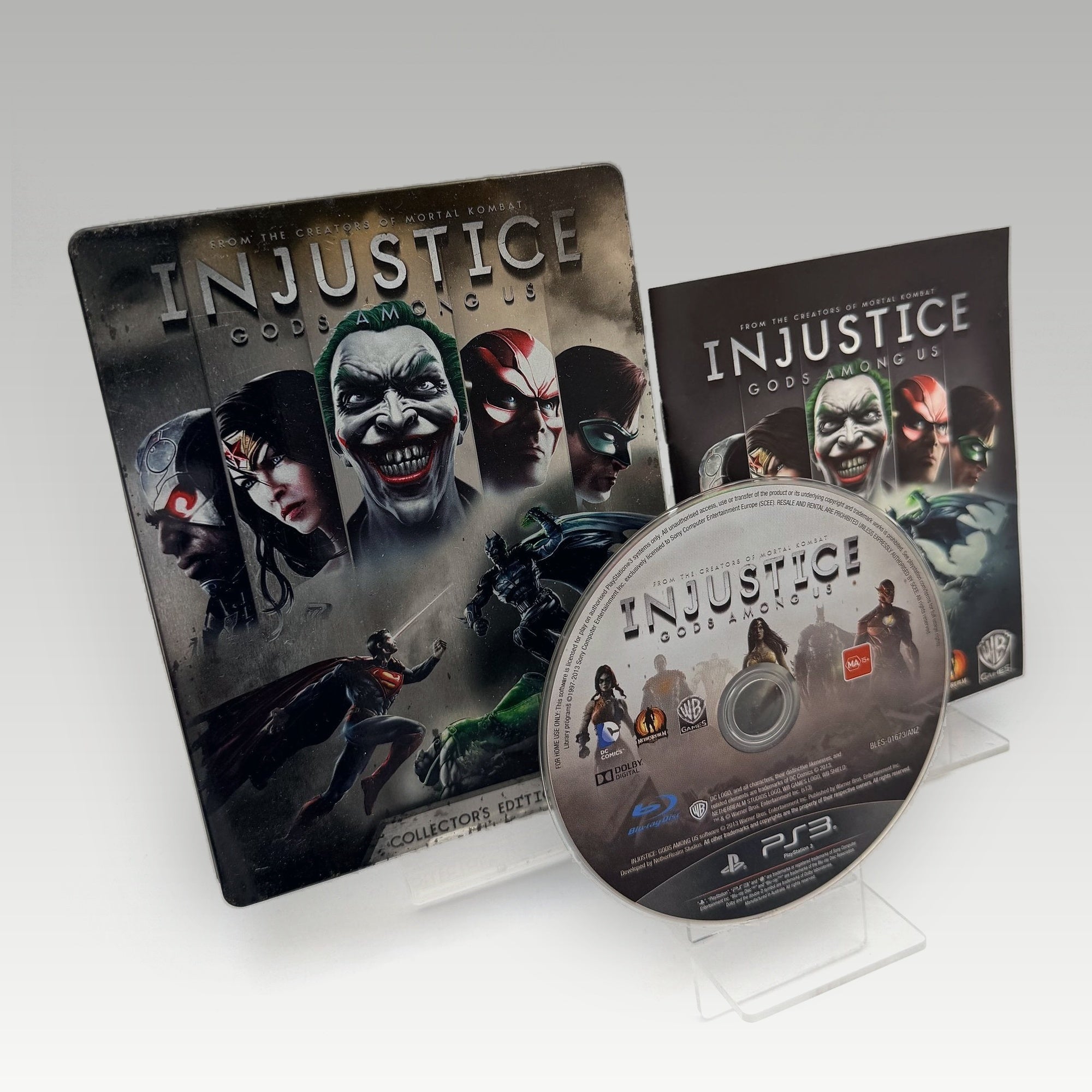 Injustice: Gods Among Us (Case Dent) Special Steelbook Edition • CIB (Region 2, Special Steelbook Edition) - Image 1