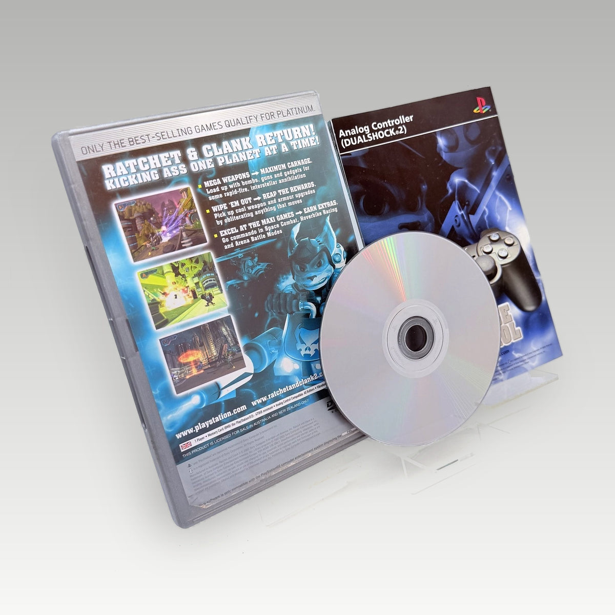 Ratchet & Clank 2: Locked & Loaded (Platinum) Original Disc • CIB (PAL, Original Disc) - Back Cover | Yappa NZ